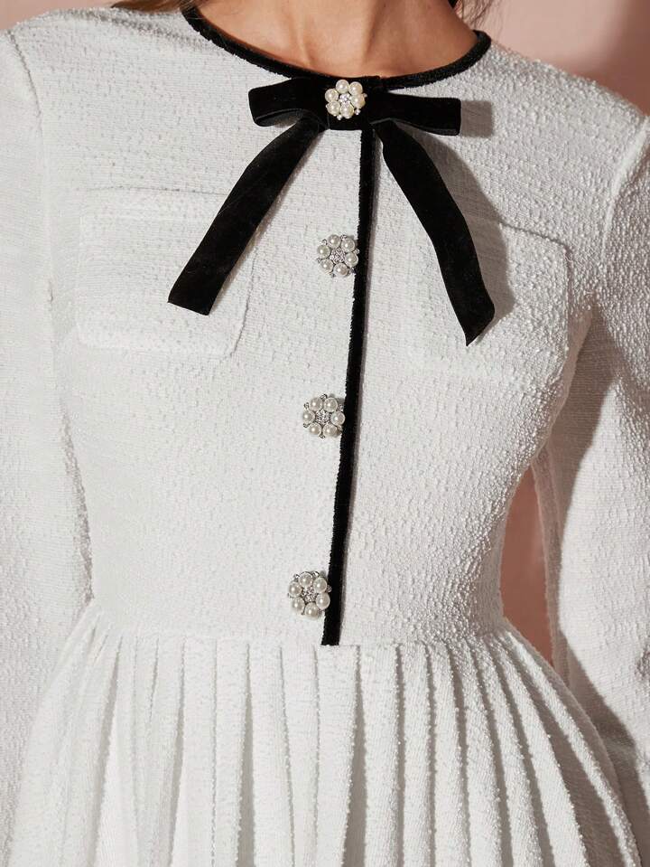 CM-DS977384 Women Elegant Seoul Style Bow Decor Round Neck Long Sleeve Pleated Hem Mini Dress - White