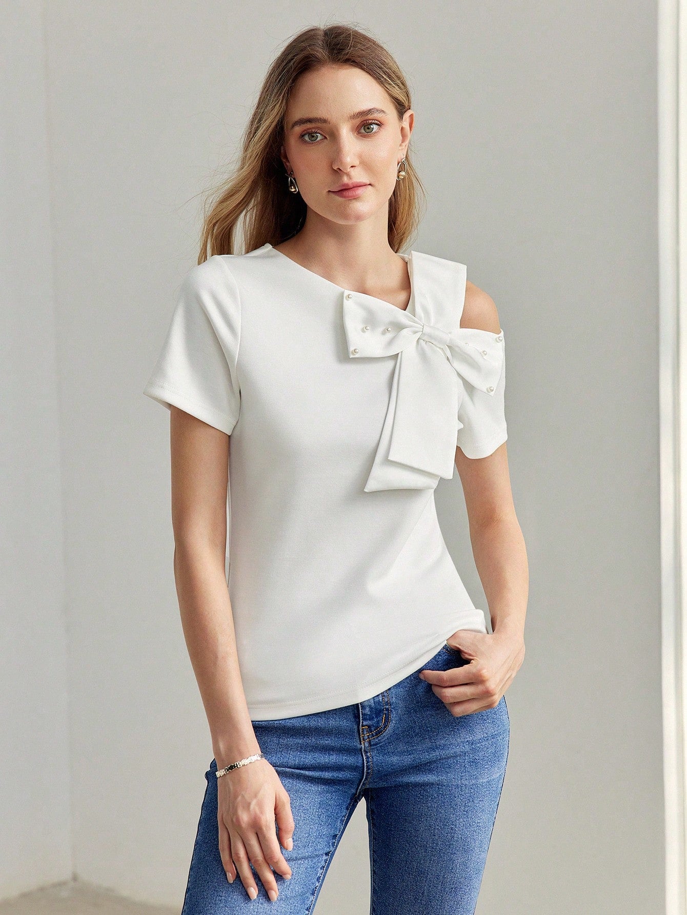 CM-TS070099 Women Casual Seoul Style Asymmetrical Shoulder Faux Pearl Bow Detail Shirt - White