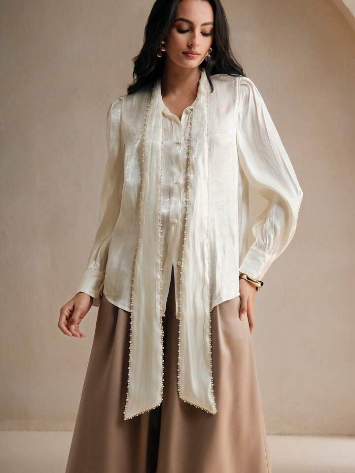 CM-TS379258 Women Elegant Seoul Style Tie Neck Pearl Knot Loose Long Sleeve Blouse - Apricot