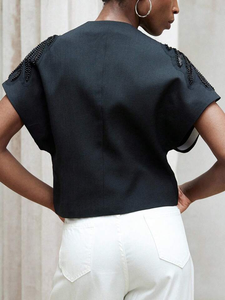 CM-TS354339 Women Elegant Seoul Style Asymmetrical Hem V-Neck Padded Beaded Embroidered Blouse - Black